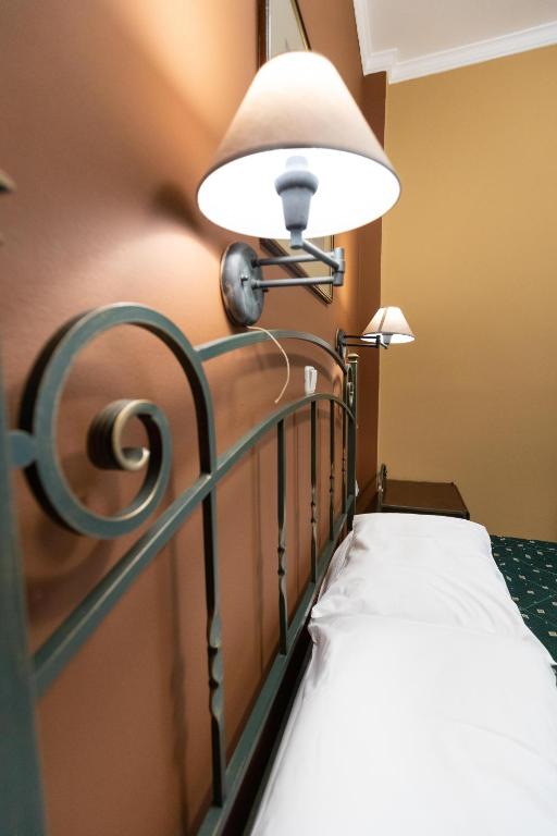 Postel nebo postele na pokoji v ubytování Amfitrion