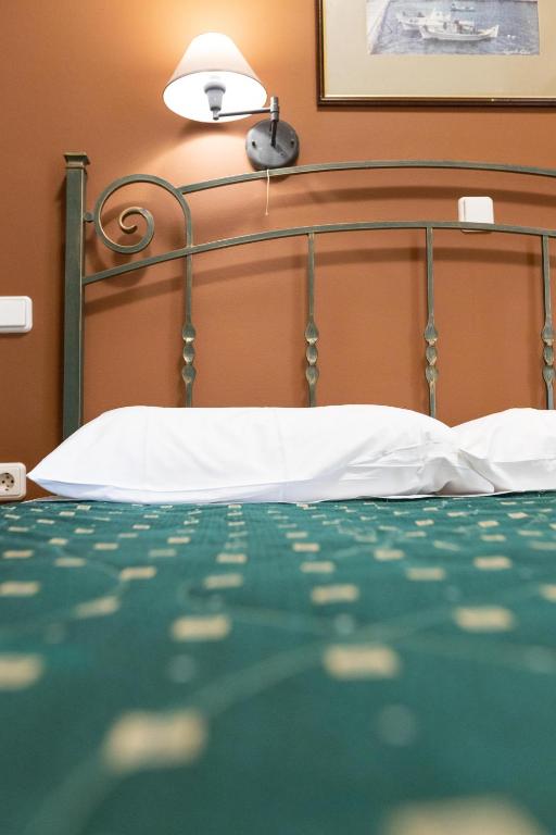 Postel nebo postele na pokoji v ubytování Amfitrion