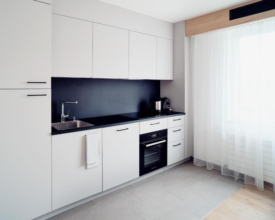 Kuchyň nebo kuchyňský kout v ubytování Hotel Neu-Schönstatt