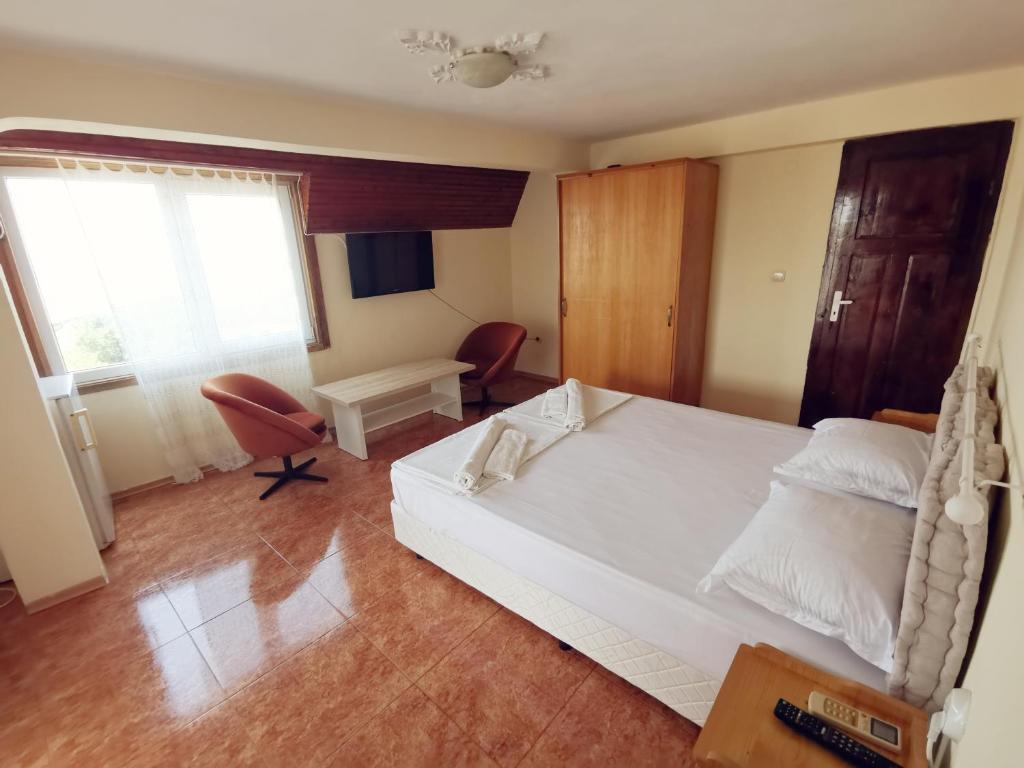 Postel nebo postele na pokoji v ubytování Hotel VALDI