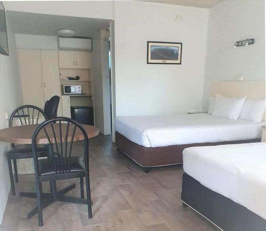 Postel nebo postele na pokoji v ubytování Zebra Motel