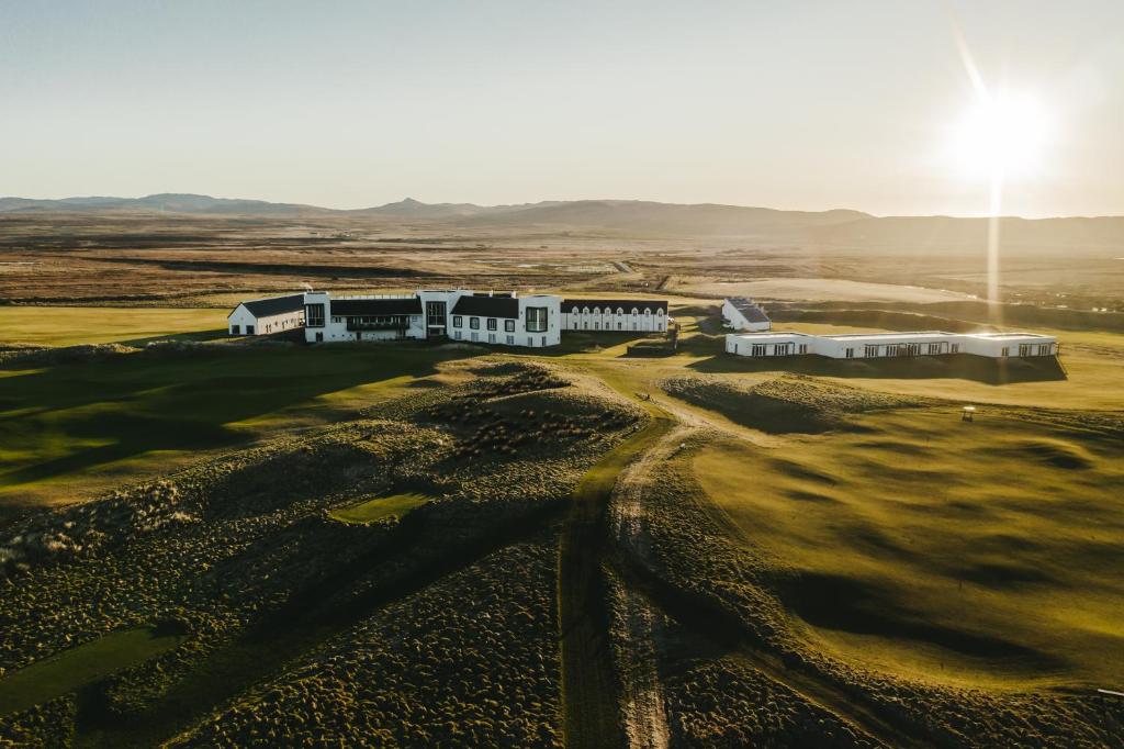 an aerial view of a building in the desert at Machrie Hotel & Golf Links in Port Ellen