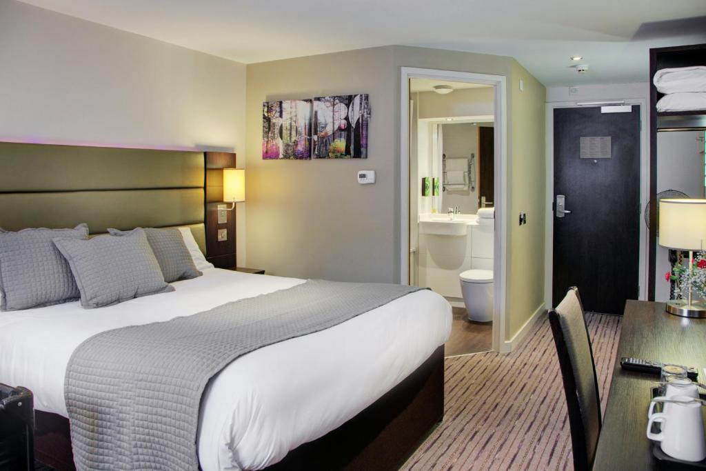 A bed or beds in a room at Fortune Huddersfield; Sure Hotel Collection by Best Western