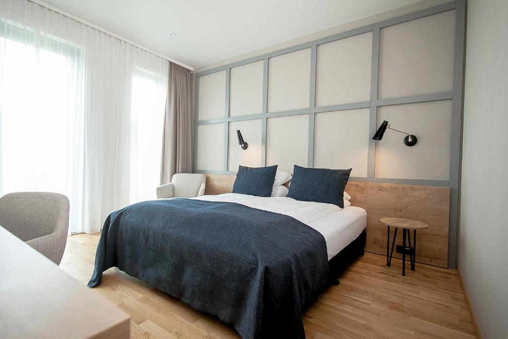 Postel nebo postele na pokoji v ubytování Fosshotel Reykholt