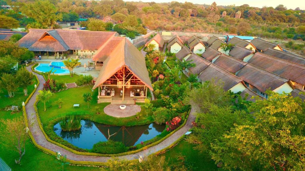 an overhead view of a large house with a pool at Shearwater's Explorers Village in Victoria Falls