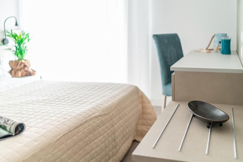 Postel nebo postele na pokoji v ubytování Hotel Pigalle