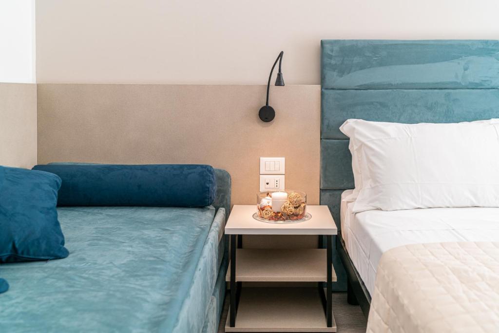 Postel nebo postele na pokoji v ubytování Hotel Pigalle