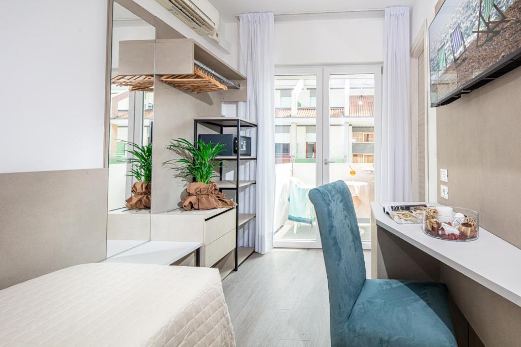 TV a/nebo společenská místnost v ubytování Hotel Pigalle
