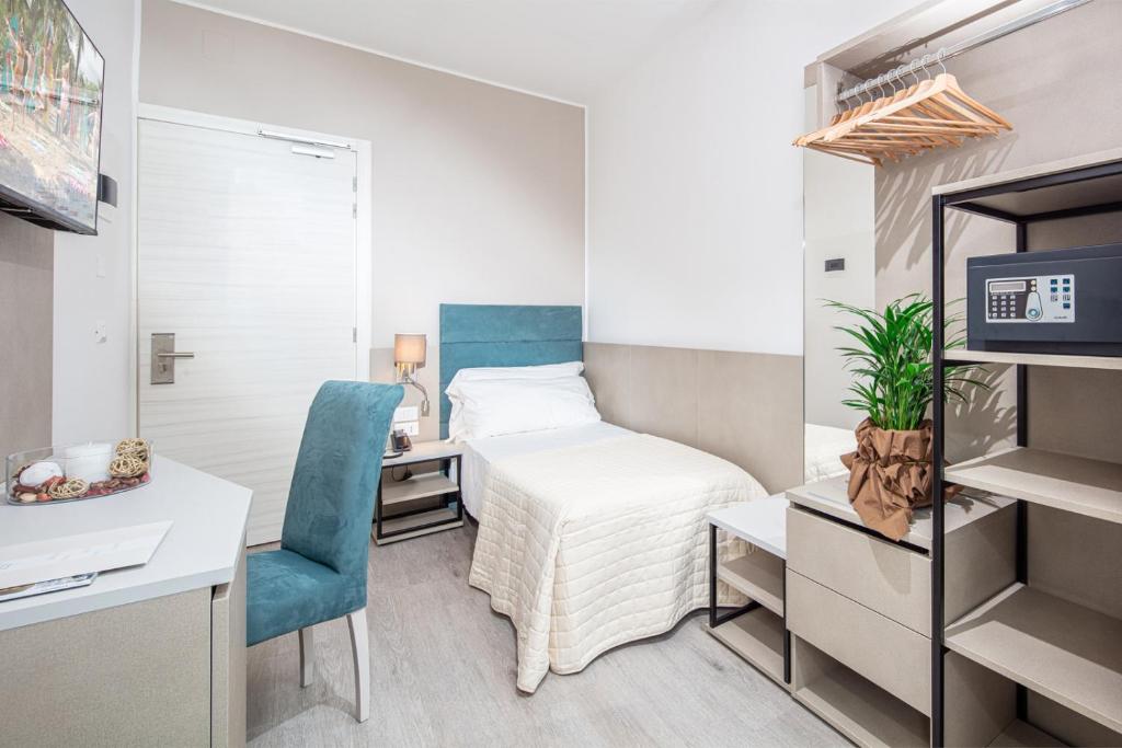 Postel nebo postele na pokoji v ubytování Hotel Pigalle