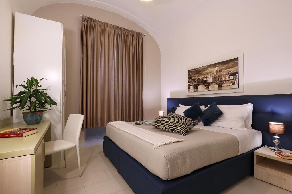 Łóżko lub łóżka w pokoju w obiekcie Grand Tour Rome Apartment - Liberty Collection