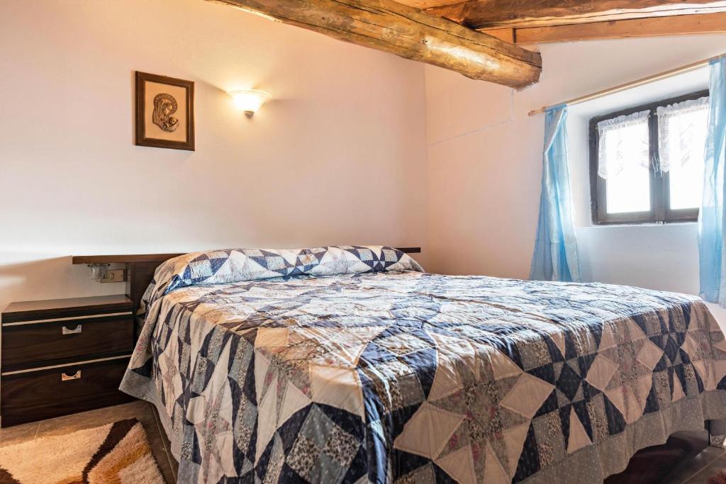 Postel nebo postele na pokoji v ubytování Baita Località Cap