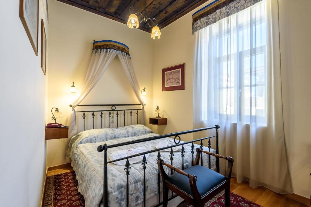 Postel nebo postele na pokoji v ubytování Belmondo Hotel