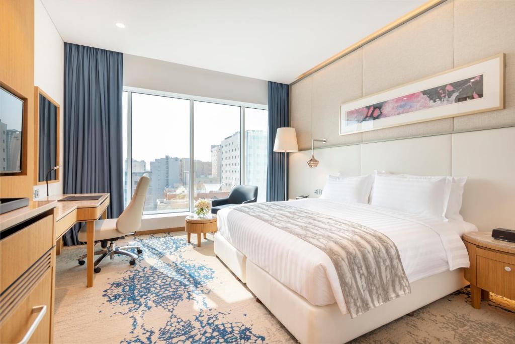 Postel nebo postele na pokoji v ubytování Jouri a Murwab hotel Doha