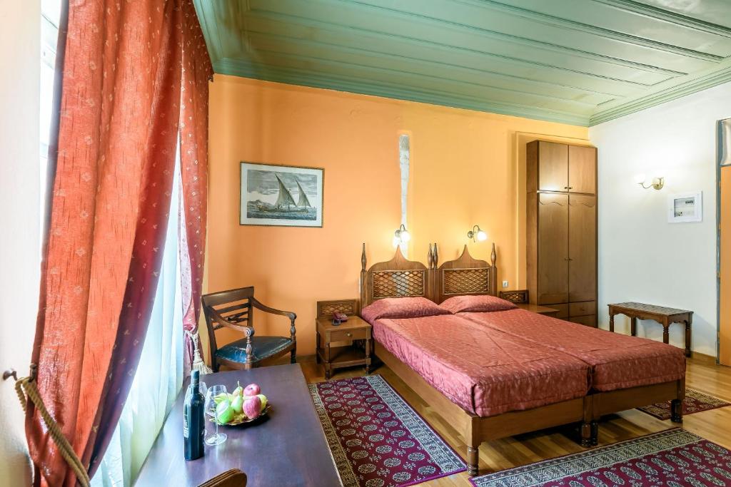 Postel nebo postele na pokoji v ubytování Belmondo Hotel