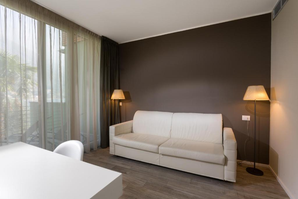 Postel nebo postele na pokoji v ubytování Hotel Maximilian