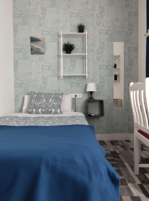 Cama o camas de una habitación en Fuencarral Adeco