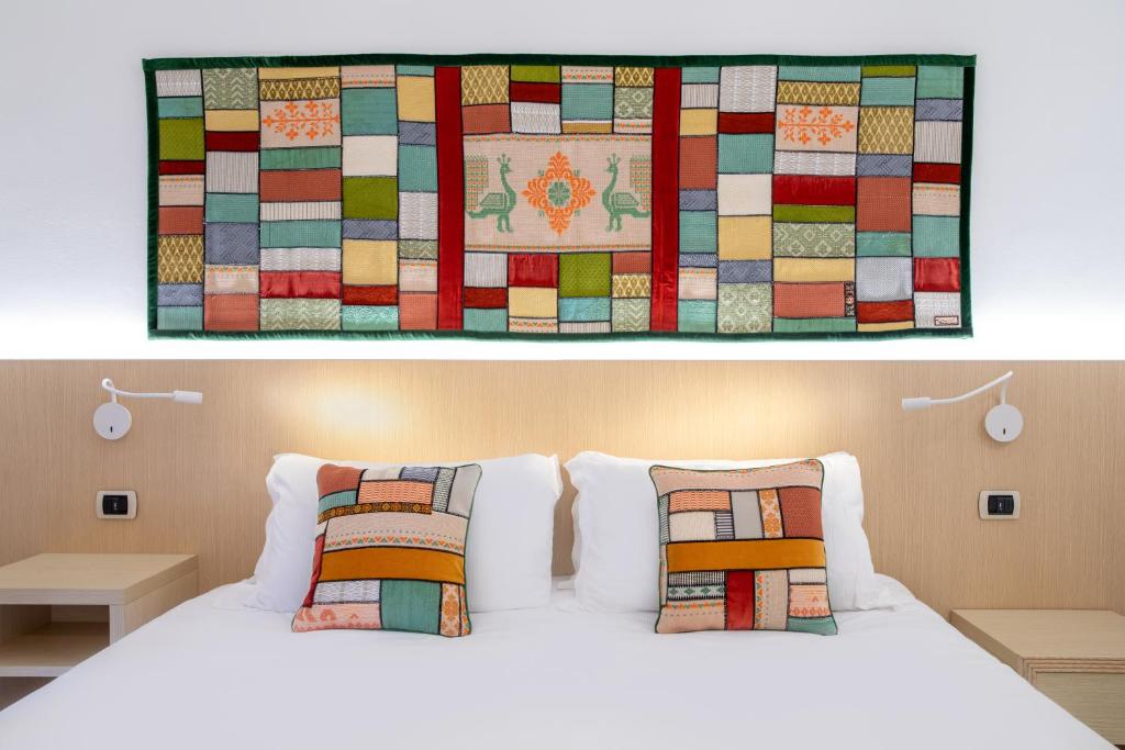 Een bed of bedden in een kamer bij Hotel Corte Rosada