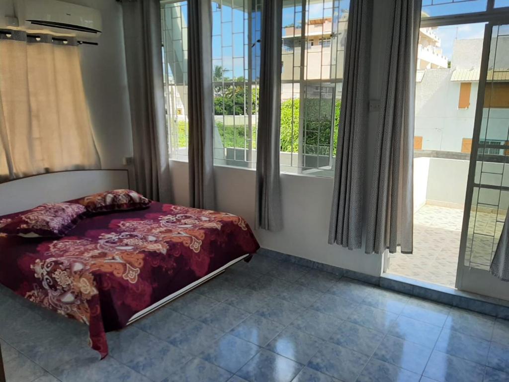 Postel nebo postele na pokoji v ubytování Villa La Famille Dodo