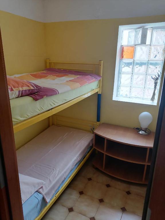Postel nebo postele na pokoji v ubytování Zupan apartments