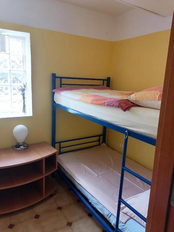 Postel nebo postele na pokoji v ubytování Zupan apartments