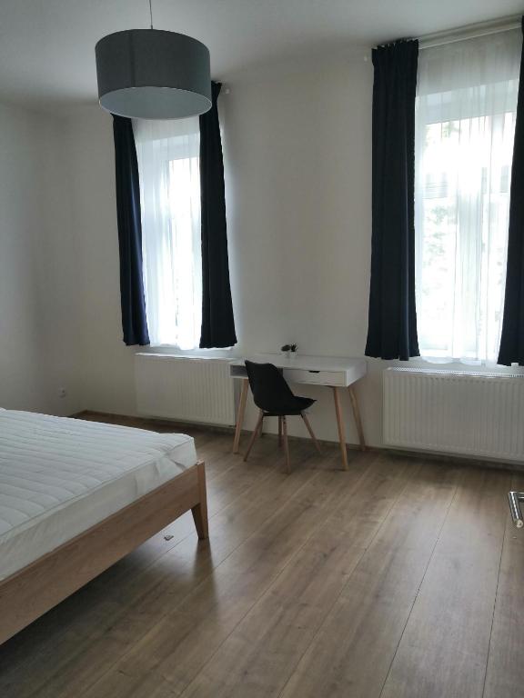 Postel nebo postele na pokoji v ubytování Znojmo apartmány