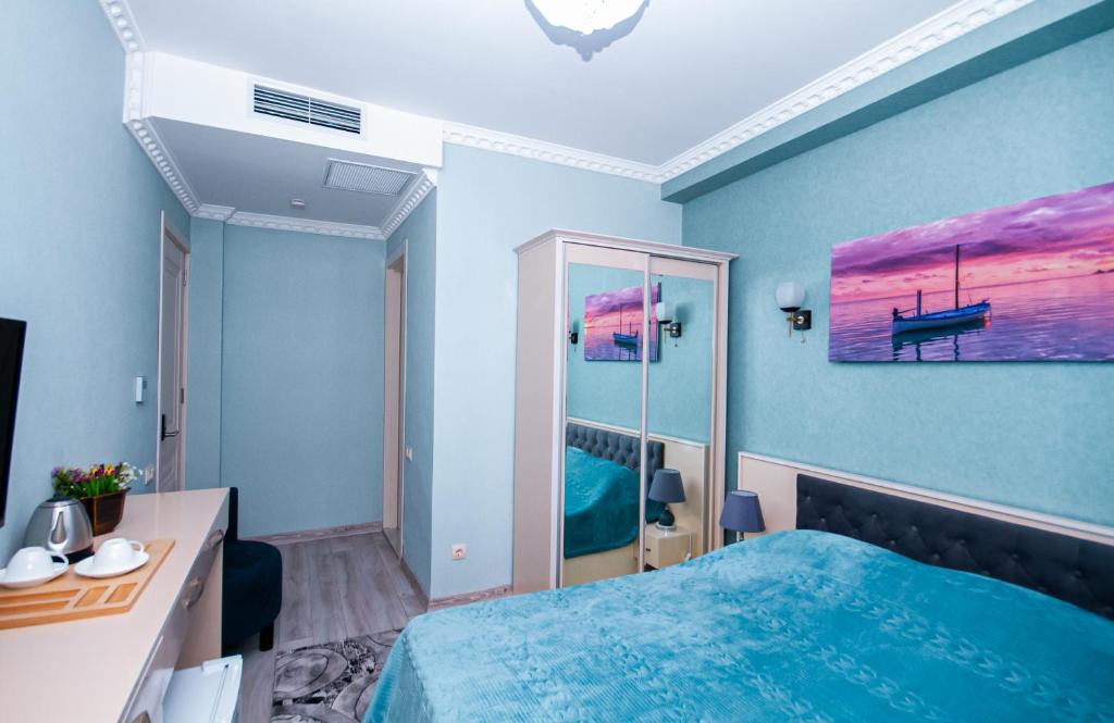 Postel nebo postele na pokoji v ubytování MUSMORE Boutique Hotel