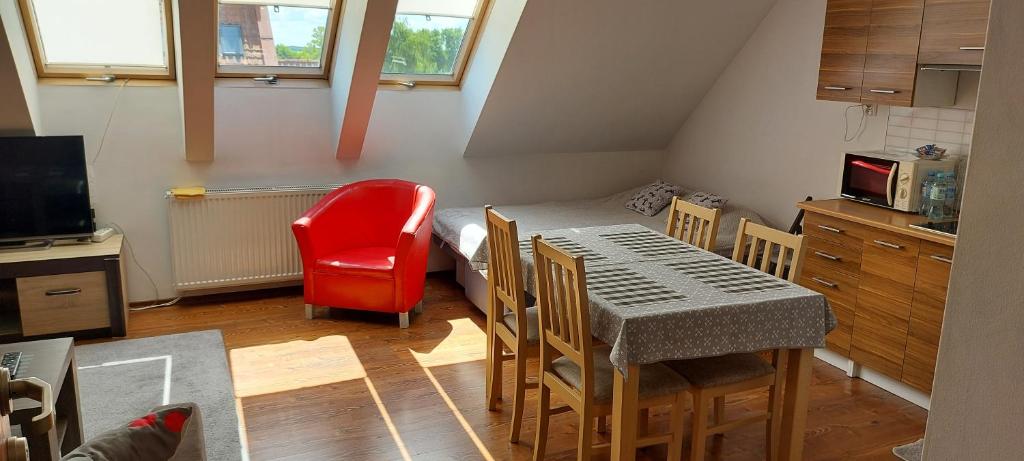 Televízia a/alebo spoločenská miestnosť v ubytovaní Apartament Studio