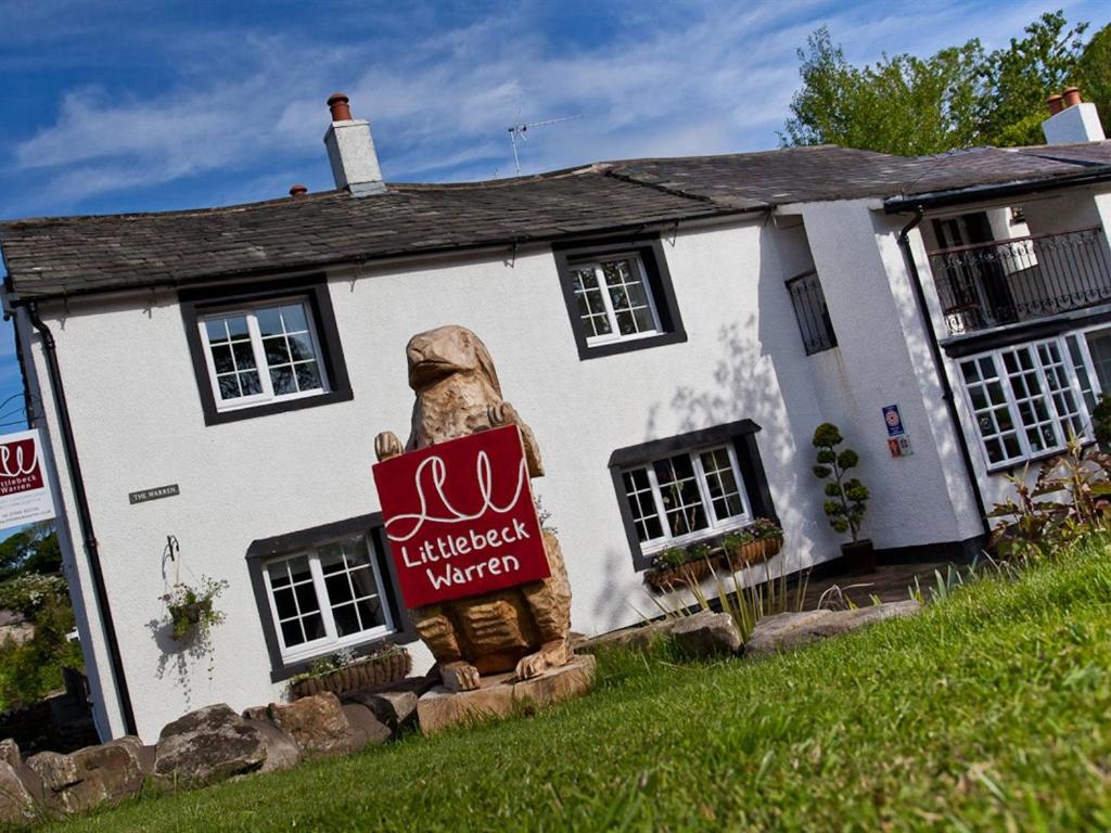 a bear sign in front of a house at Littlebeck Warren in Whitehaven