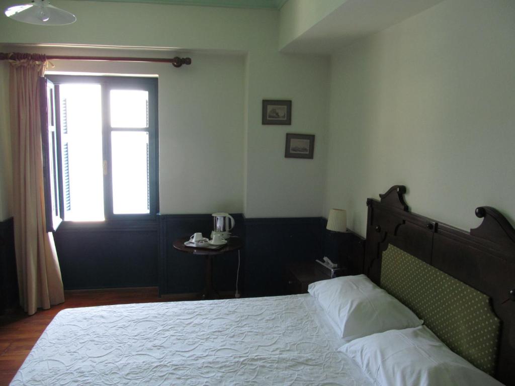 Postel nebo postele na pokoji v ubytování Hotel Aliki