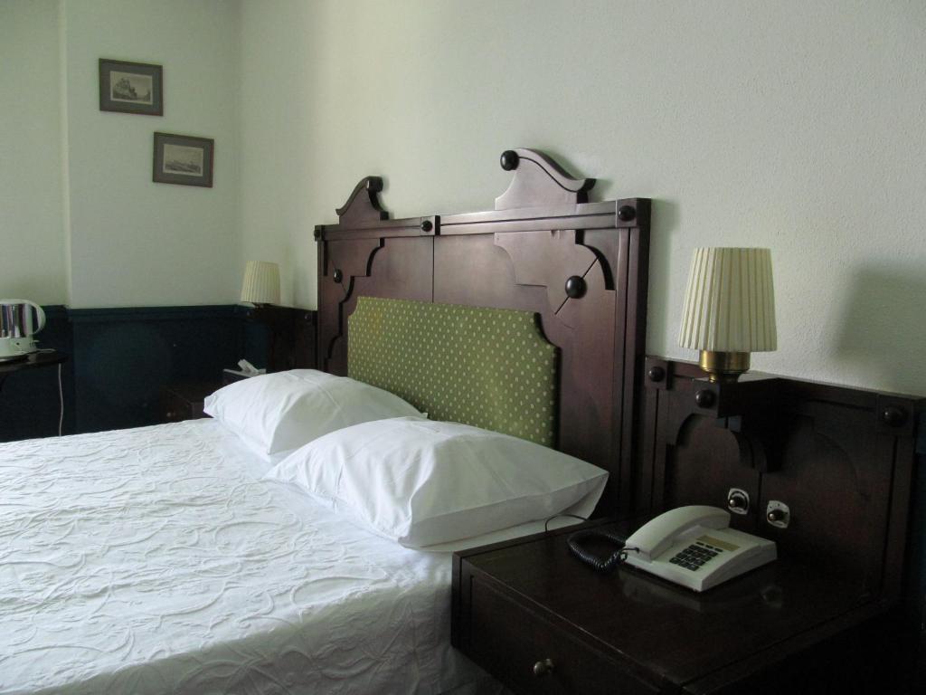 Postel nebo postele na pokoji v ubytování Hotel Aliki