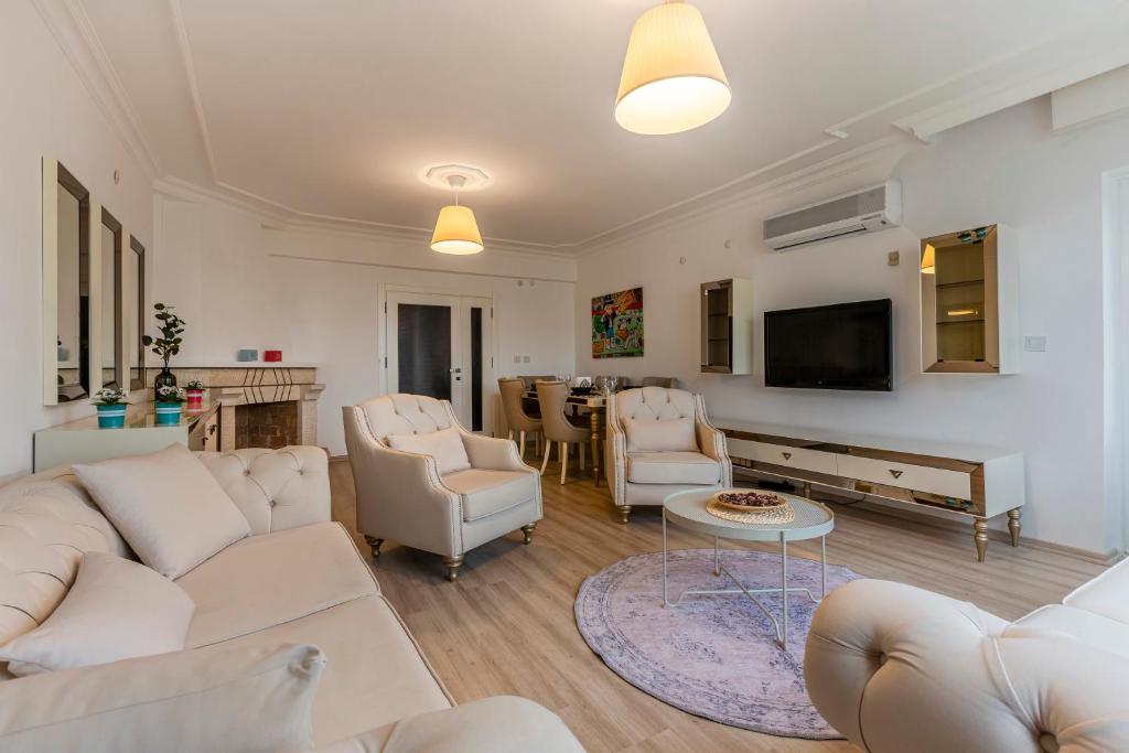 A television and/or entertainment centre at Melissas Suites Lara