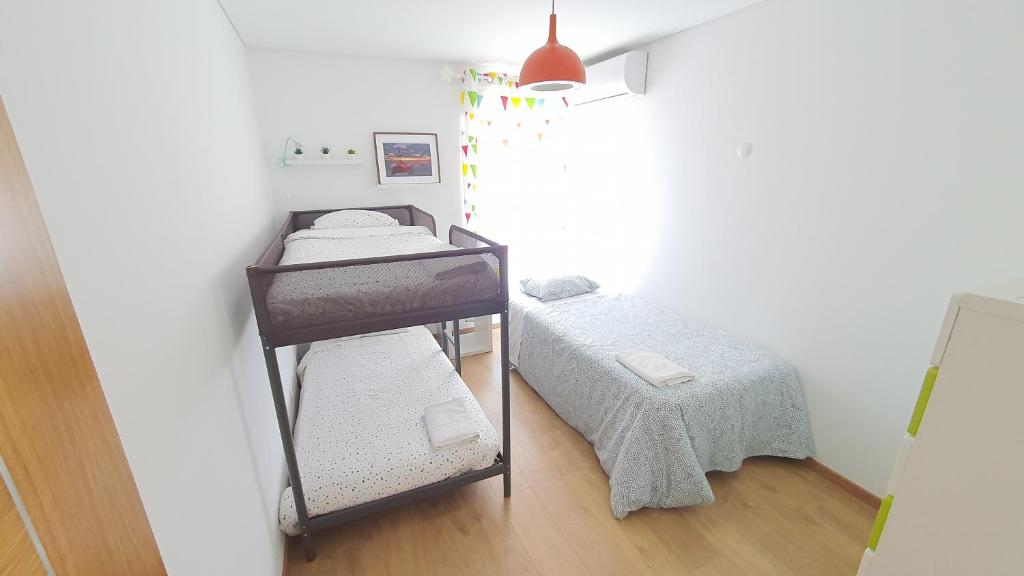 Postel nebo postele na pokoji v ubytování A Casa do Parque