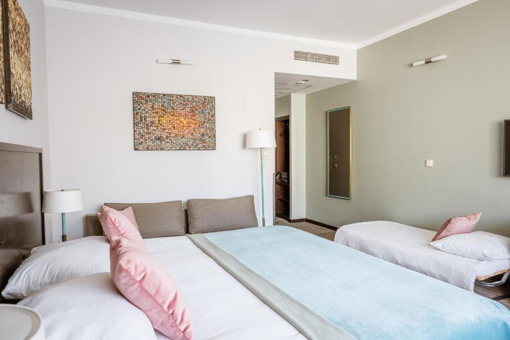 Posteľ alebo postele v izbe v ubytovaní Europeum Hotel