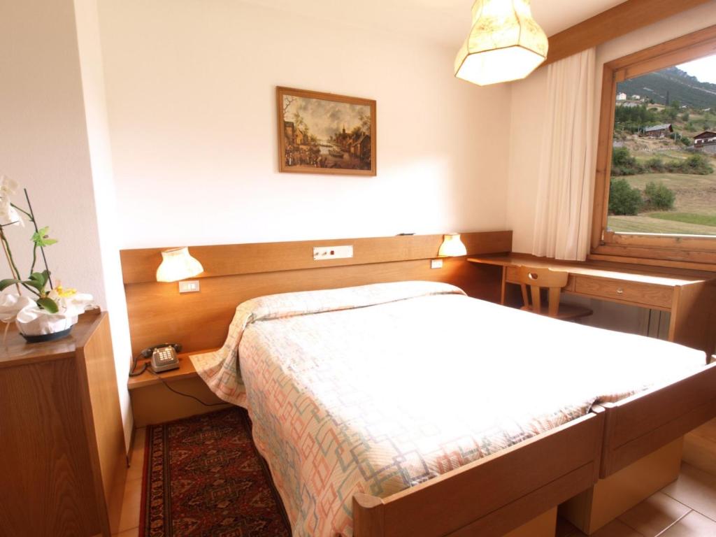 Postel nebo postele na pokoji v ubytování Hotel Gardenia
