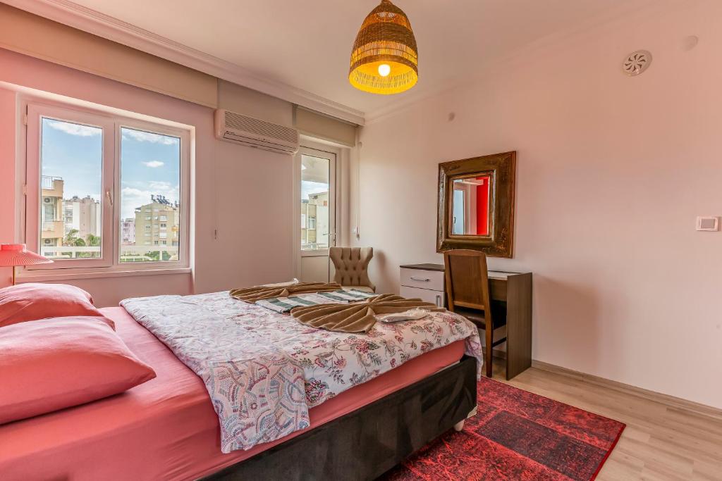 A bed or beds in a room at Melissas Suites Lara
