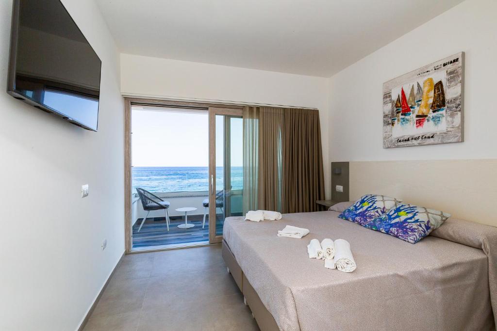 Postel nebo postele na pokoji v ubytování Hotel Caramare
