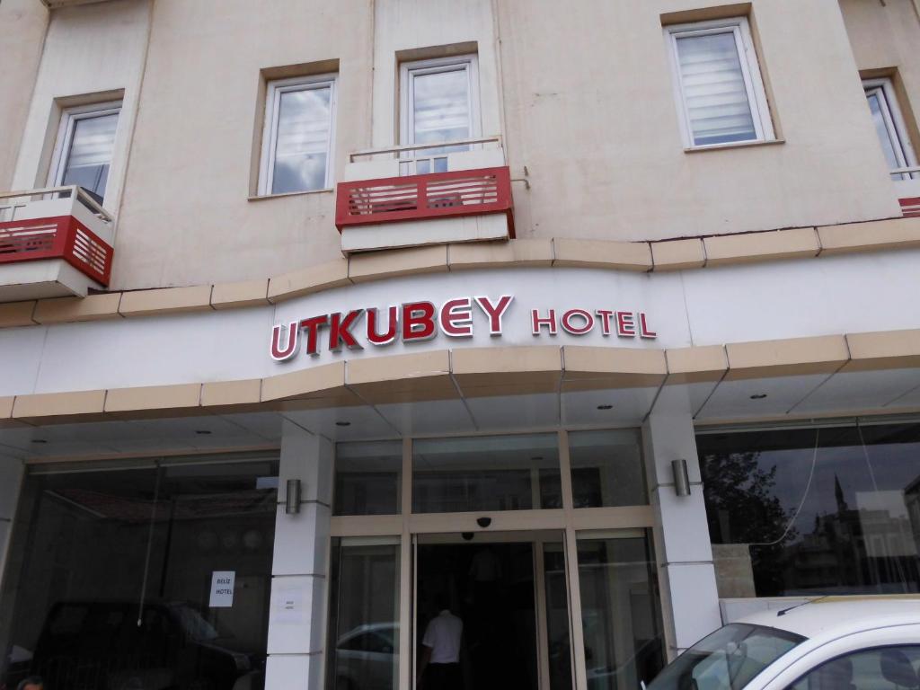 a building with a sign for a university hospital at Utkubey Hotel in Gaziantep