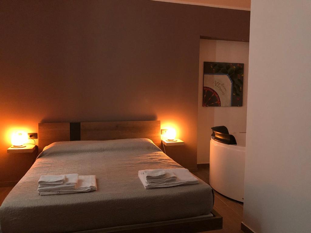 Postel nebo postele na pokoji v ubytování Dimore Albrunè