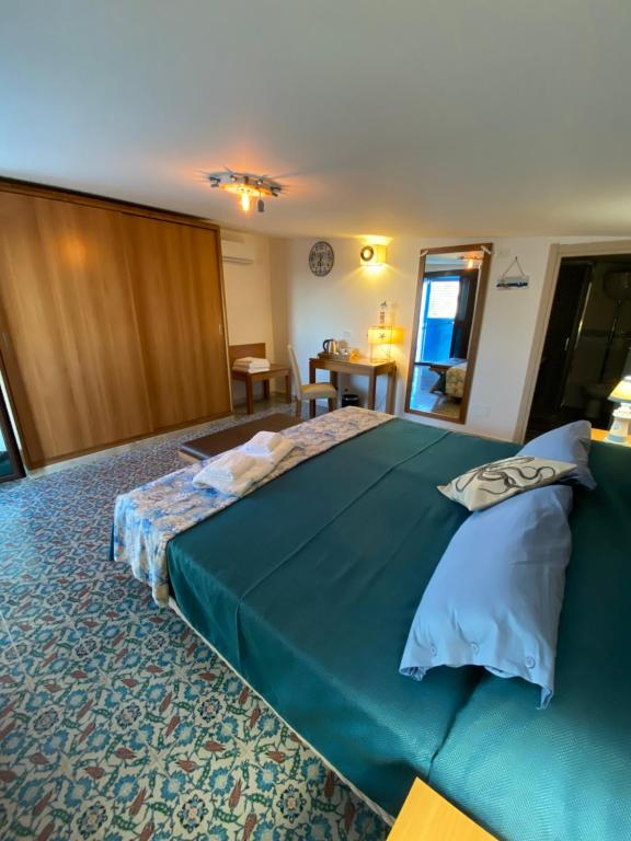 Posteľ alebo postele v izbe v ubytovaní B&B Torre Pozzillo