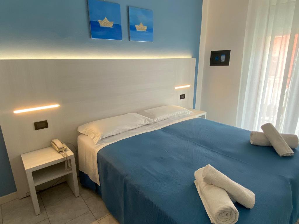 Postel nebo postele na pokoji v ubytování Hotel Stella Alpina
