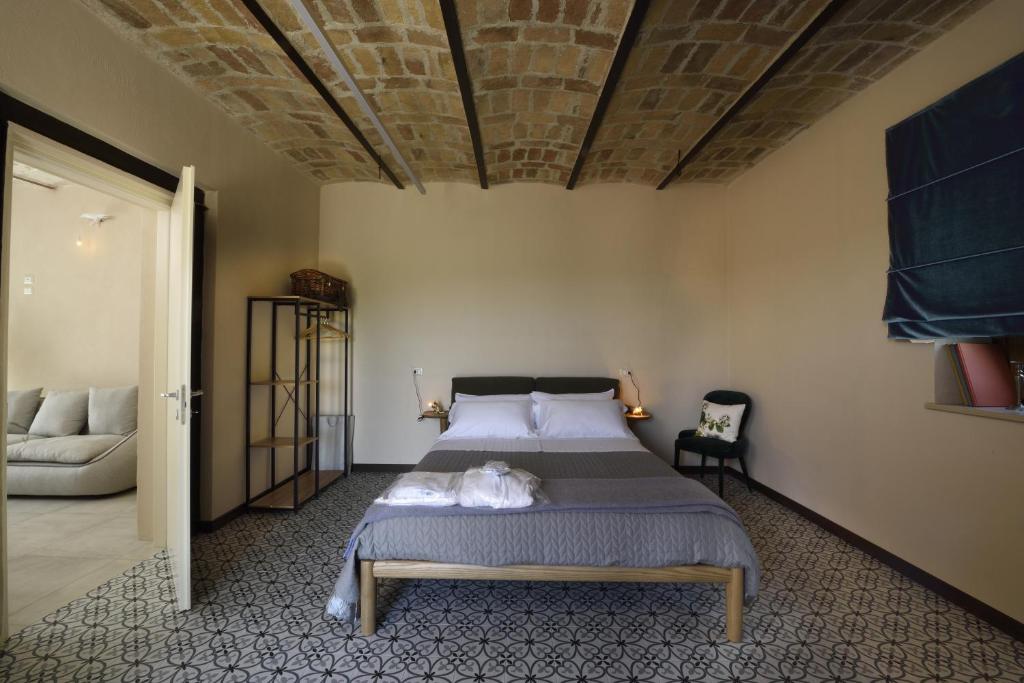 Posteľ alebo postele v izbe v ubytovaní La Cascina di Chiara