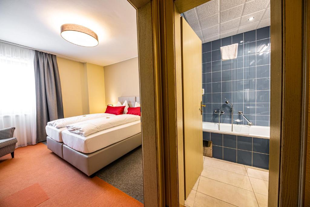 Posteľ alebo postele v izbe v ubytovaní Motel Zeltweg - Self-Check-in