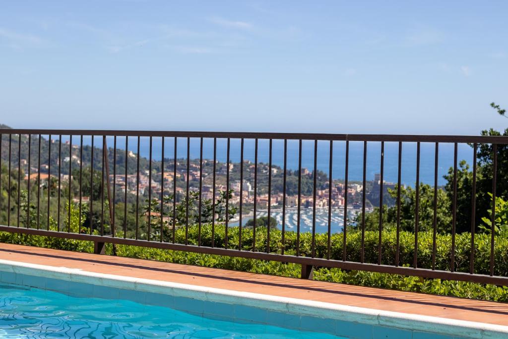 a view from the balcony of a house with a swimming pool at Blue Lodge Lerici in San Terenzo