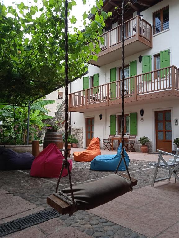 a group of hammocks in front of a building at La Bella Corte in Arco
