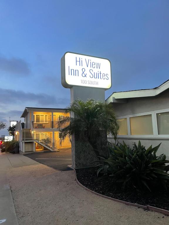 a sign for a inn and suites in front of a building at Hi View Inn & Suites in Manhattan Beach