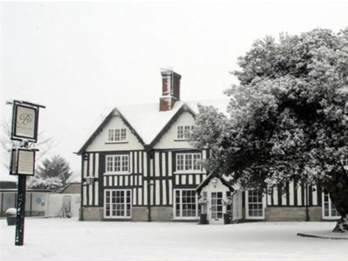 a black and white photo of a house at Broom Hall Inn in Stratford-upon-Avon