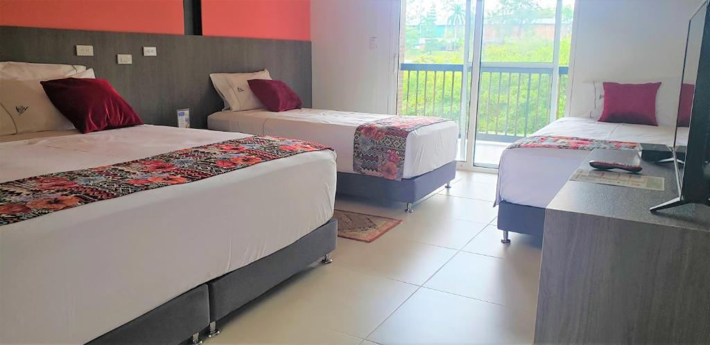 Postel nebo postele na pokoji v ubytování Villa Juana Hotel
