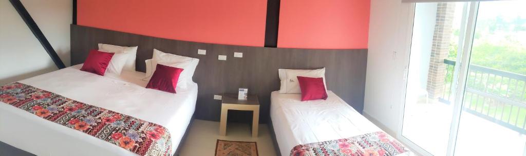 Postel nebo postele na pokoji v ubytování Villa Juana Hotel