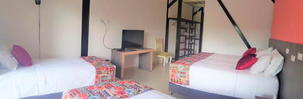 Postel nebo postele na pokoji v ubytování Villa Juana Hotel