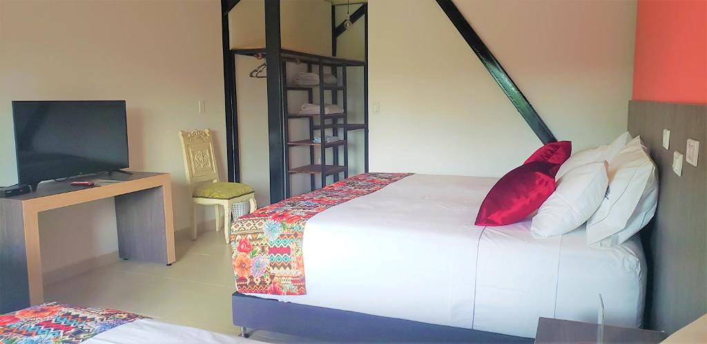Postel nebo postele na pokoji v ubytování Villa Juana Hotel